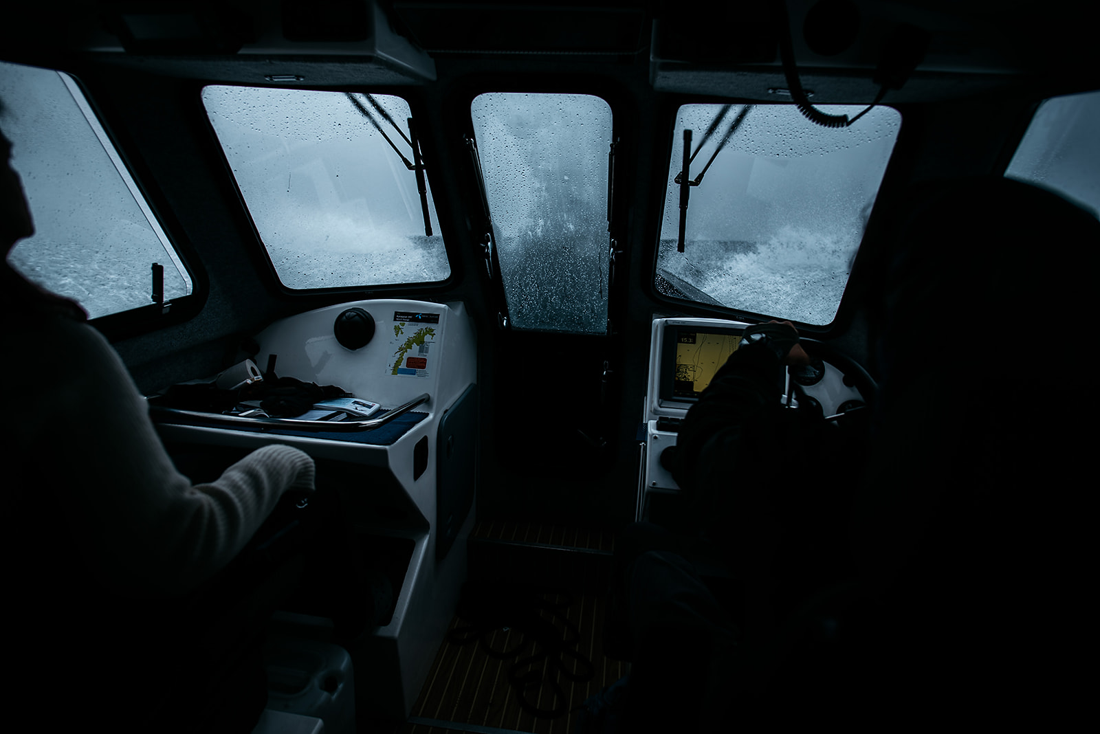 waves from rough sea  clashing against a boat window