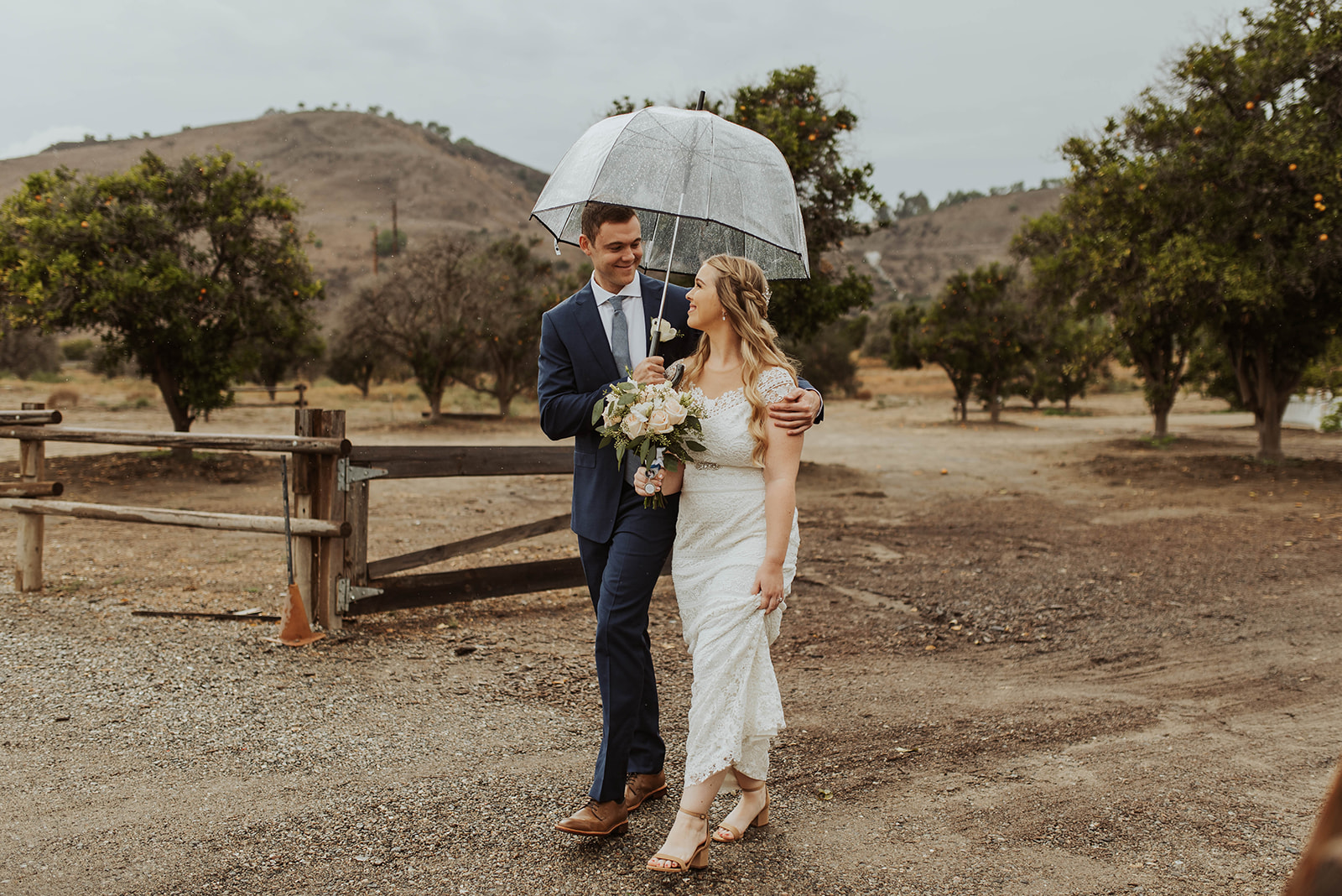 couple gets married at rainy outdoor wedding