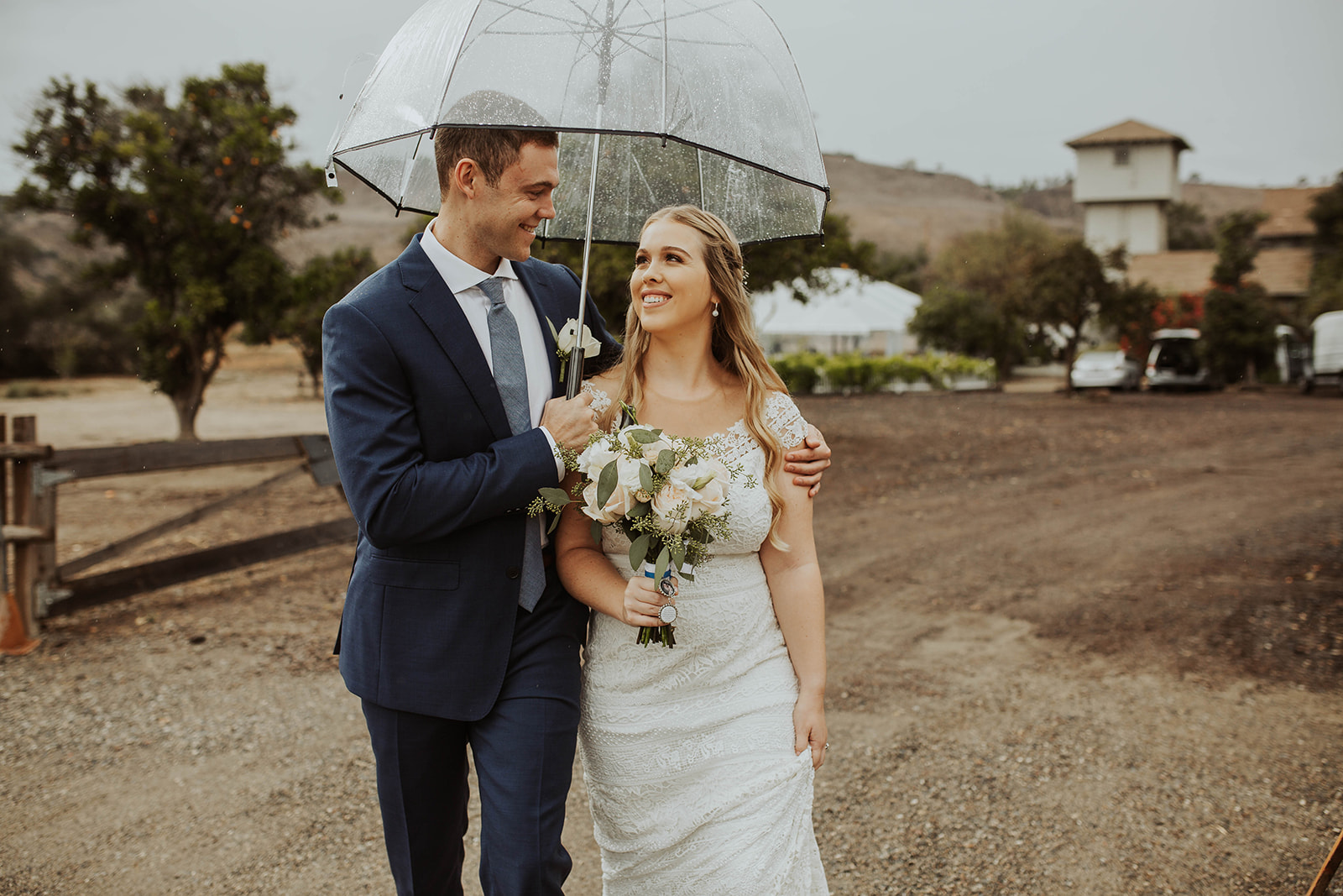 couple gets married at rainy outdoor wedding